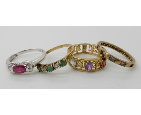 A 9ct white gold ruby and diamond accent ring size N, a 9ct aquamarine, garnet and amethyst set band ring, size O1/2 and two 