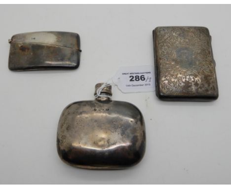 A lot comprising a silver spirit flask, Birmingham marks, a silver aide memoire, Chester 1903 and a silver card case, Chester