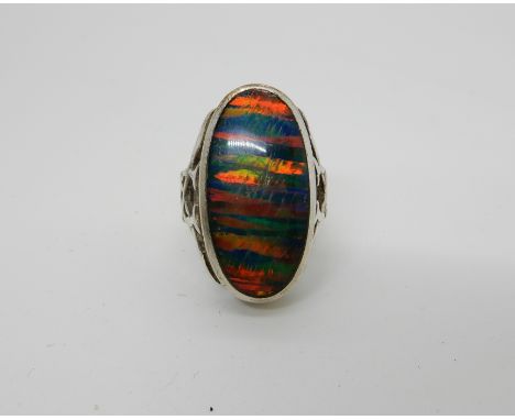 A silver ring set with a large opal triplet with knotwork shoulders size P1/2 Condition Report: Not available for this lot