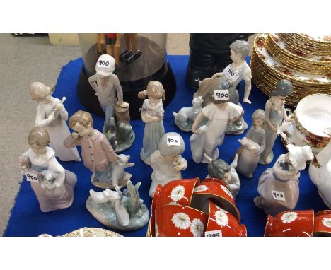 A collection of Nao and Lladro figures mainly of children and pets (13) Condition Report: all in good condition. 