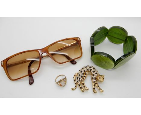 A 9ct gold cameo ring weight 2.7gms, a leopard brooch, vintage Christian Dior sunglasses and a bracelet Condition Report: Not