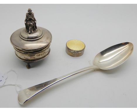 A lot comprising a silver jewellery box with figural finial, Birmingham 1921, a silver tablespoon, London 1808 and a white me