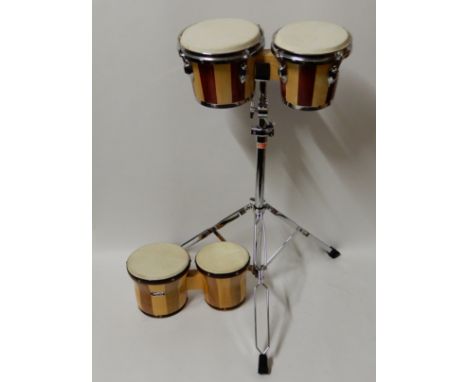 A set of bongo drums with stand and another set by El Cometa Condition Report: Available upon request