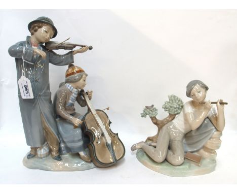 A large Nao figure of a boy playing a violin and a girl playing a cello together with a Lladro figure of a boy playing a pipe