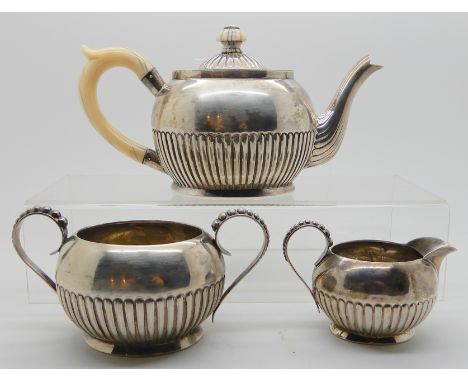 A Bachelor's three piece silver tea service by Hillard &amp; Thomason, Birmingham 1888, of oval form with half ribbed body, i