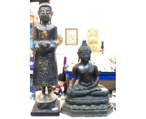 A cast metal Tibetan Buddha and a gilded wood figure Condition Report: wooden figure 71cm high. A couple of losses to mirrore