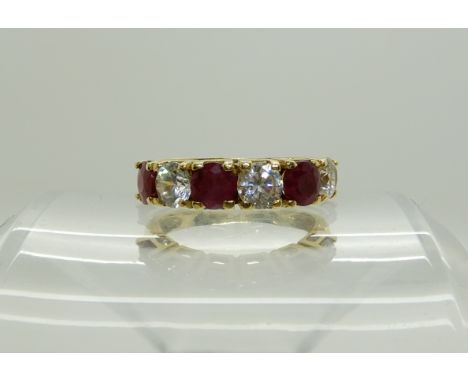 A continental bright yellow metal ruby and clear gem ring, size P, weight 5gms Condition Report: Available upon request