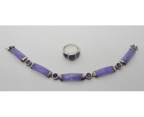 A silver mount lilac hardstone bracelet with Chinese symbols and a similar ring Condition Report: Not available for this lot