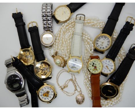 A 9ct gold locket and chain weight 4.2gms, two Mickey Mouse watches, a retro Casio Illuminator watch and other watches and a 