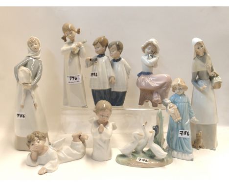 Eight assorted Lladro and Nao figures and another figure Condition Report: Available upon request