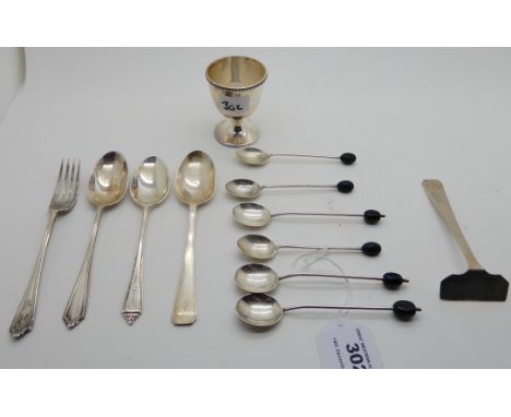 A lot comprising a silver egg cup, Birmingham 1937 and assorted silver spoons, a fork and a pusher, assorted marks (12), 182g