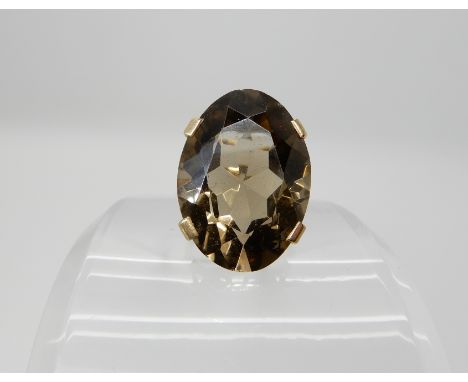 A 9ct large smoky quartz ring, approx 25mm x 18mm x 11.5mm, finger size K, weight 9.6gms Condition Report: Available upon req