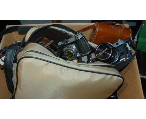 A collection of various cameras and accessories and a portable typewriter Condition Report: Available upon request