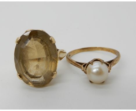 A 9ct gold smoky quartz ring size O1/2 and a 9ct gold pearl ring size R, combined weight 8.2gms Condition Report: Available u