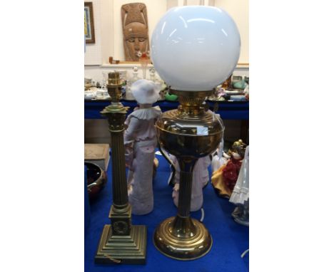 A brass Corinthian column table lamp together with a brass oil lamp Condition Report: Available upon request