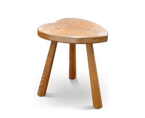 ALAN GRAINGER, AN ACORNMAN OAK STOOL, the adzed heart-shaped seat raised on three faceted tapering splayed legs, with carved 