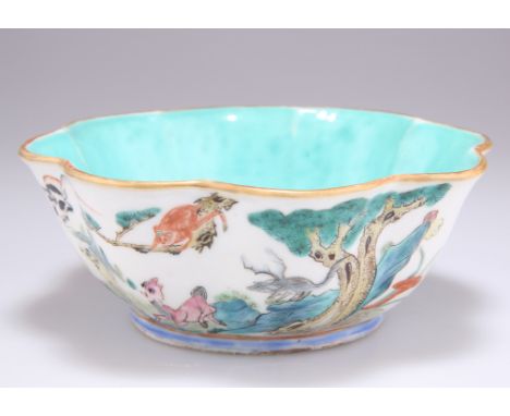 A 19TH CENTURY CHINESE FAMILLE ROSE ZODIAC BOWL, of scalloped form, the exterior painted with the twelve signs of the zodiac 