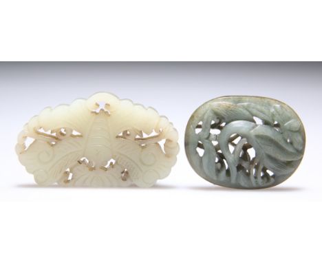 TWO JADE PLAQUE CARVINGS, in low relief and pierced, one of a moth, the other of leaves. (2) 3.7cm by 6.6cm and 3.8cm by 5cmC