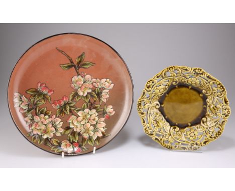 CHRISTOPHER DRESSER FOR LINTHORPE POTTERY, A CHARGER,&nbsp;circular, enamel decorated in low relief with flowers and foliage,