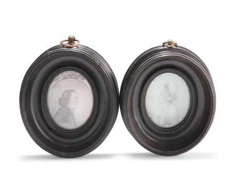 A PAIR OF GEORGE III PORTRAIT MINIATURES, facing dexter and sinister, each inscribed verso, "Thomas Banks of ? 1790...Ann Ban
