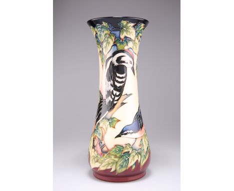 A MOORCROFT POTTERY VASE, of trumpet form with a flared neck, tubelined and hand-painted with Philip Gibson's 'Inglewood' pat