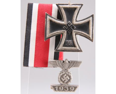 A GERMAN 2ND CLASS IRON CROSS, and ribbon, together with a second award bar, the latter marked L/12. (2)&nbsp;CONDITION REPOR