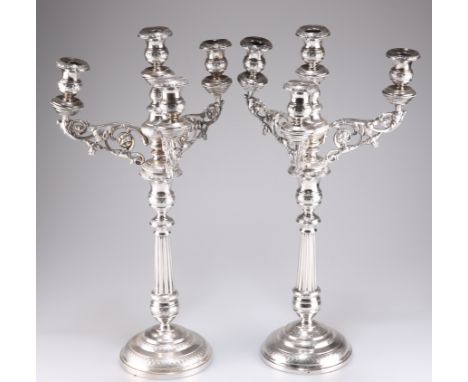 A PAIR OF 19TH CENTURY CONTINENTAL SILVER FOUR-LIGHT CANDELABRA, each with scrolling foliate-form branches and fluted taperin