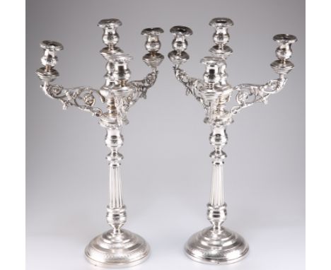 A PAIR OF 19TH CENTURY CONTINENTAL SILVER FOUR-LIGHT CANDELABRA, each with scrolling foliate-form branches and fluted taperin