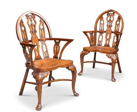 A PAIR OF GOTHIC STYLE STAINED BEECH WINDSOR ARMCHAIRS, each with architectural pointed arch back, raised on cabriole foreleg