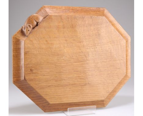 ROBERT THOMPSON OF KILBURN, A MOUSEMAN OAK BREADBOARD, of octagonal form, lightly adzed, with carved mouse signature. 25cm by