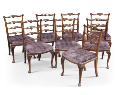 A SET OF EIGHT GEORGE III STYLE MAHOGANY DINING CHAIRS, each with openwork wavy ladder back, raised on leaf-carved cabriole l