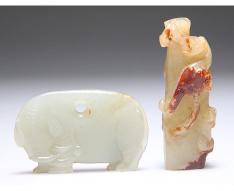 A JADE CARVING OF A QUILIN AND YOUNG, climbing a pillar, 6.8cm by 2.5cm; and A JADE PLAQUE CARVING OF AN ELEPHANT, 3.5cm by 5
