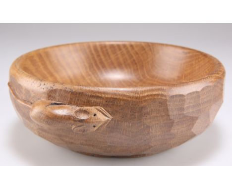 ROBERT THOMPSON OF KILBURN, A MOUSEMAN OAK NUT BOWL, with adzed exterior and carved mouse signature. 6cm by 15.5cmCONDITION R