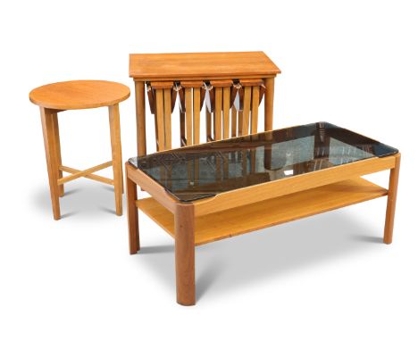 A MYER TEAK AND SMOKED GLASS COFFEE TABLE, CIRCA 1970S, with shelf stretcher, unmarked; together with A NEST OF FOUR TEAK TAB