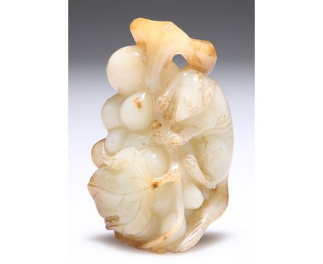 A JADE CARVING OF A SQUIRREL AND GRAPES.&nbsp;7cm by 4.5cmCONDITION REPORTSmall area of roughness to one leaf edge.