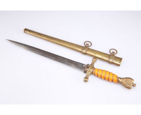 A GERMAN KRIEGSMARINE DAGGER, with orange grip and brass scabbard, the blade engraved 'ALCOSO / SOLINGEN'. 42cm overallCONDIT