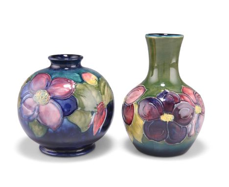 A MOORCROFT POTTERY VASE, globular form with a flared neck, 'Clematis' pattern, tubelined and hand-painted in tones of purple