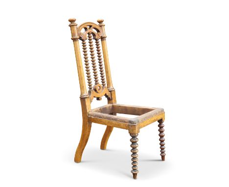 A VICTORIAN BEECH APPRENTICE’S CHAIR, raised on bobbin-turned forelegs, with an arched crest above three boldly turned spindl