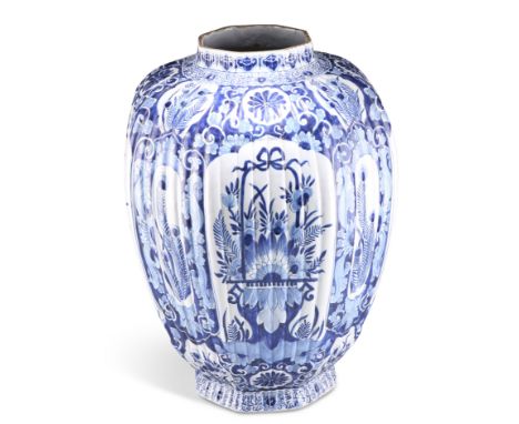 AN 18TH CENTURY LARGE DUTCH DELFT BLUE AND WHITE VASE, of ribbed octagonal baluster form, with conforming rim and foot, decor