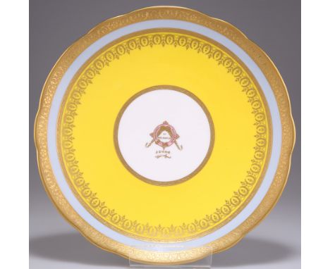 A MINTON ARMORIAL DESSERT PLATE, the centre with an armorial crest Chhatrapati Maharaja of Kolhapur, within yellow and blue e