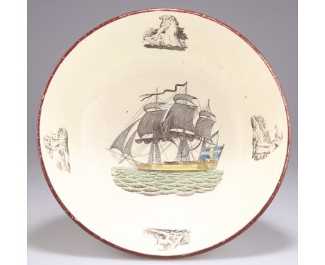 AN EARLY 19TH CENTURY ENGLISH CREAMWARE PUNCH BOWL, the well with a transfer printed design of a ship within figural panels o