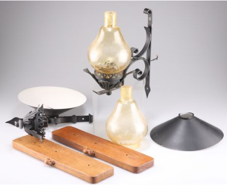 ROBERT THOMPSON OF KILBURN, A PAIR OF OAK AND JAPANNED METAL WALL LIGHTS, rectangular form, with scrolling brackets and amber