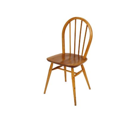 A set of four light Ercol stick back kitchen chairs