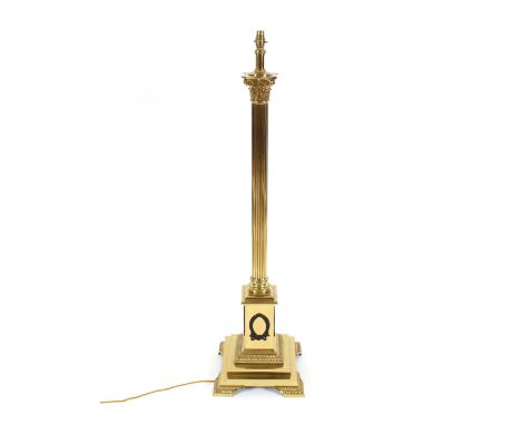 A large brass corinthian column lamp standard, raised on square foliate decorated base, 125cm high overall