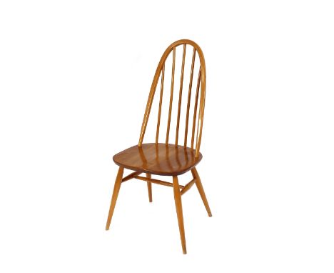 A set of four blonde Ercol stick back kitchen chairs