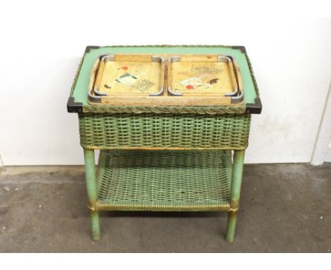 A green loom type two tier work table; and three wooden and chrome mounted cocktail trays decorated with recipes