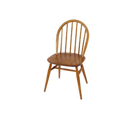 A set of four light Ercol stick back kitchen chairs