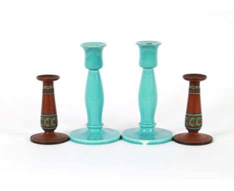 A pair of Ault Pottery candlesticks, in&nbsp;turquoise Majolica ware; and a terracotta pair of candlesticks in the manner of 