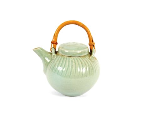 A David Leach celadon green pottery teapot, with wicker handle, stamped to base, 18cm overall, (AF)