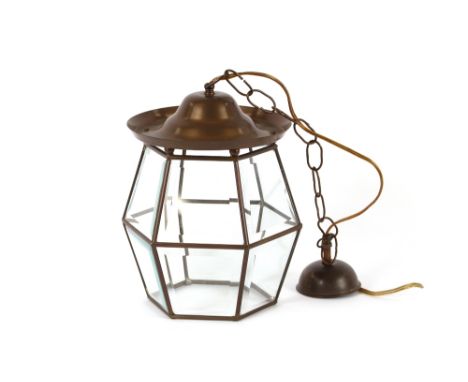 A brass Art Deco design porch lamp, having bevelled glass panels, 24cm high